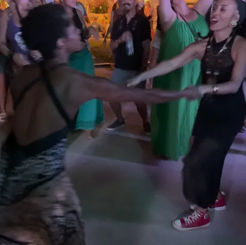 Hands joined, the floor spinning around them