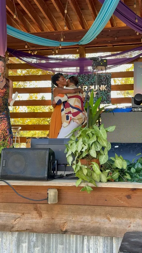 Angel and Hakeem, an embrace on stage