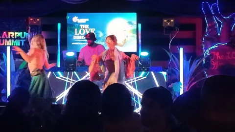 A dancer swirls at 2SeaZ's decks