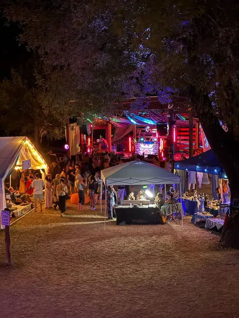 The market glowing under the oaks