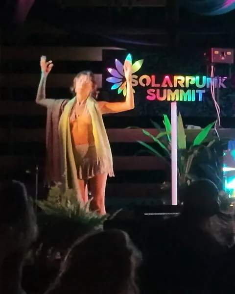 Veil dancer opens her arms