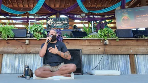 Joseph Hawley, hand on heart, sharing the Legend of the Sacred Circle