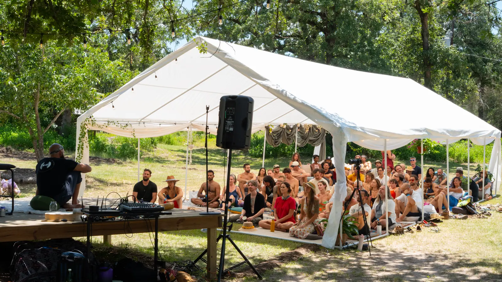 A full tent of people gathered and listening at Declaration of Sovereignty at The Haven
