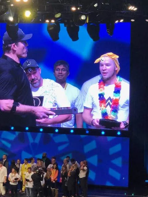 Tyler on stage at Tony Robbins Business Mastery