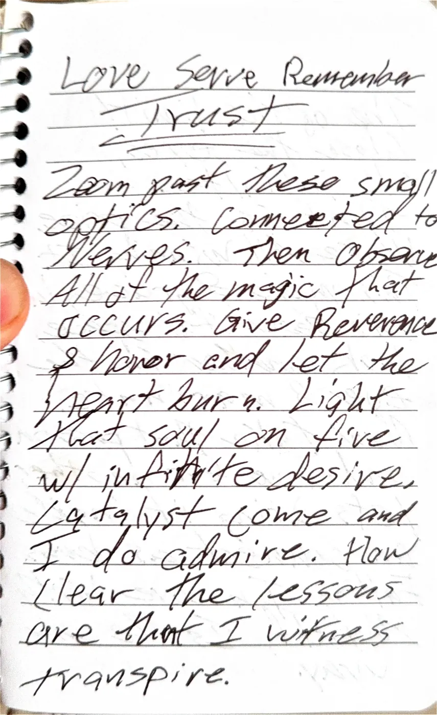 The first page of a handwritten poem headed Love Serve Remember Trust, about zooming past small optics and letting the heart burn.