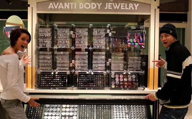Customers at the Avanti body jewelry wall
