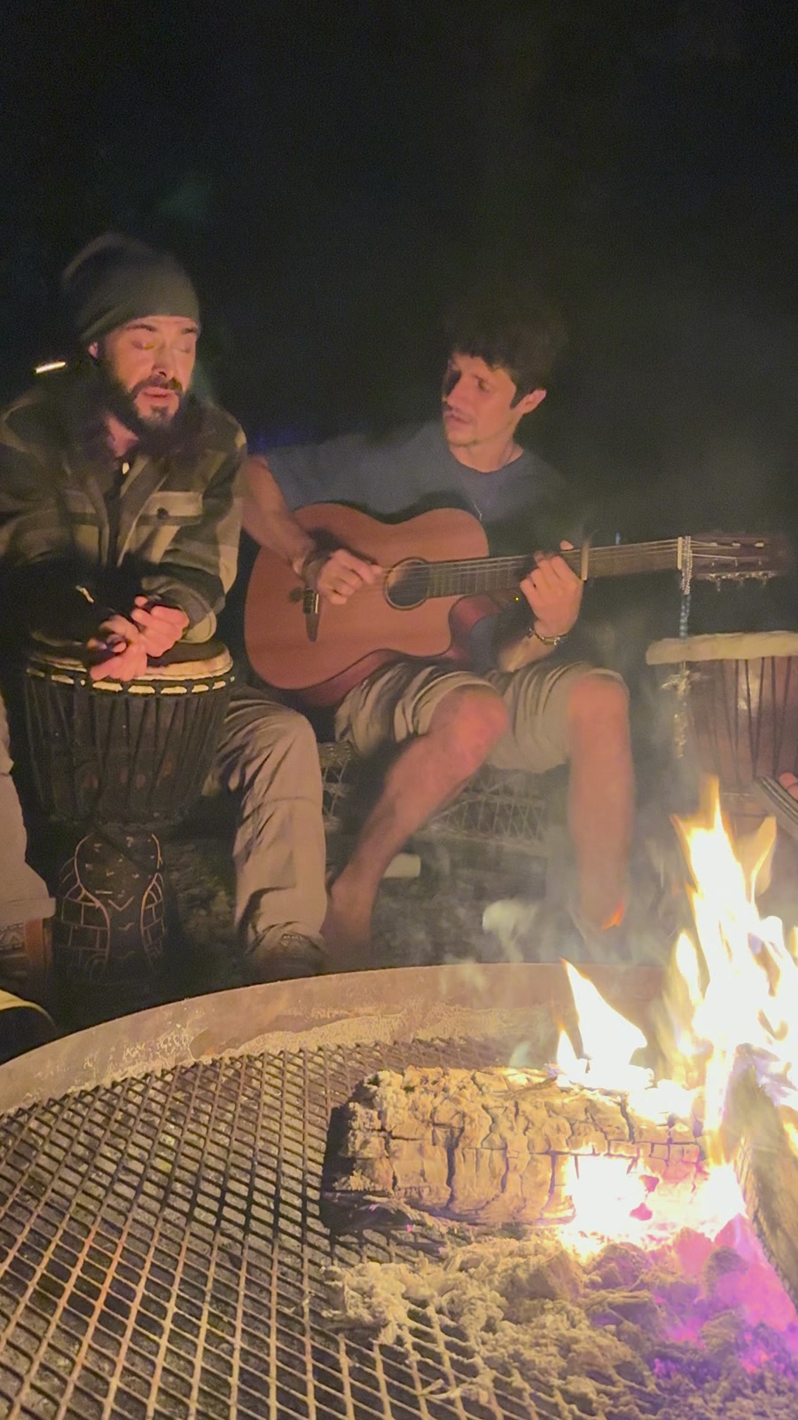 Before Fire Day's dawn: Ben on djembe, Derek Abt on guitar, singing at the big fire